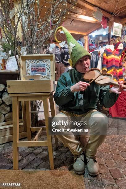 Stall holder plays some music at the "Basilica" Christmas fair on December 7, 2017 in Budapest, Hungary. The traditional Christmas market and lights...