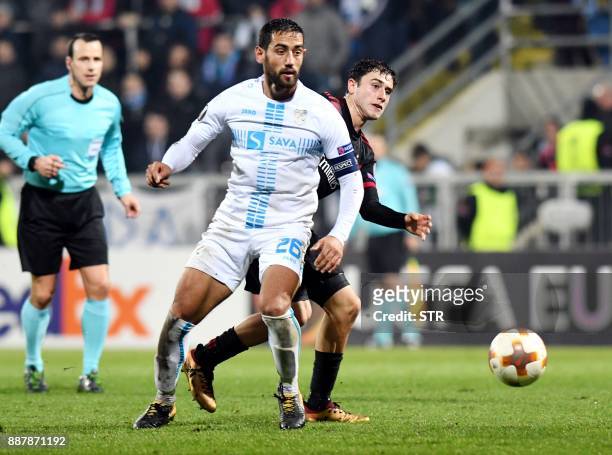 Milan's forward Patrick Cutrone fights for the ball with Rijeka's midfielder Mate Males during the UEFA Europa League Group D football match between...