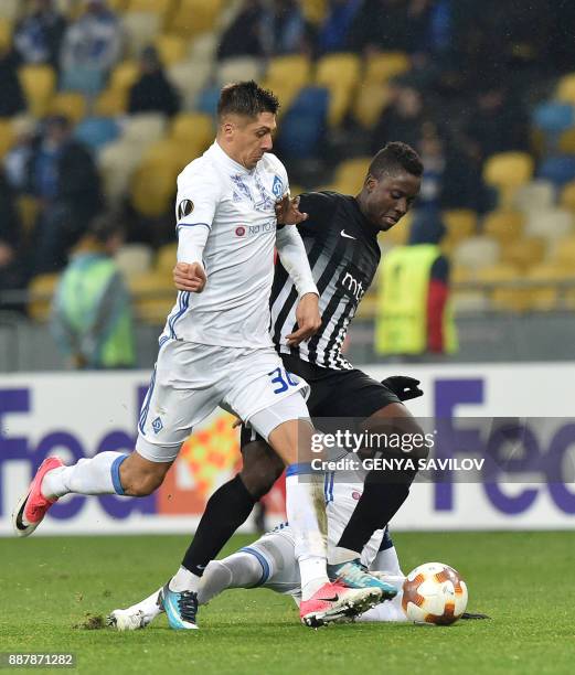 Partizan's Seydouba Soumah vies with Dynamo's Yevhen Khacheridi during the UEFA Europa League group stage football match between Dynamo Kyiv and FK...