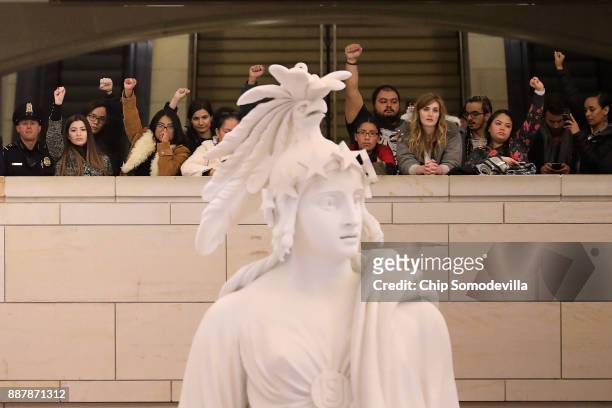Demonstrators from The Seed Project stage a protest in the U.S. Capitol Visitors Center to demand immigration reform and a renewal of the Deferred...