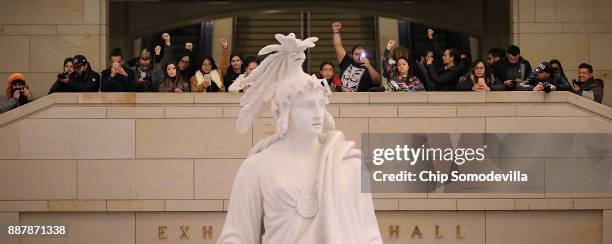 Demonstrators from The Seed Project stage a protest in the U.S. Capitol Visitors Center to demand immigration reform and a renewal of the Deferred...