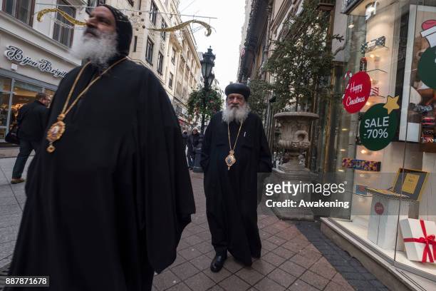 Two Orthodox priests walk along Vaci utca on December 7, 2017 in Budapest, Hungary. The traditional Christmas market and lights will stay until 31st...