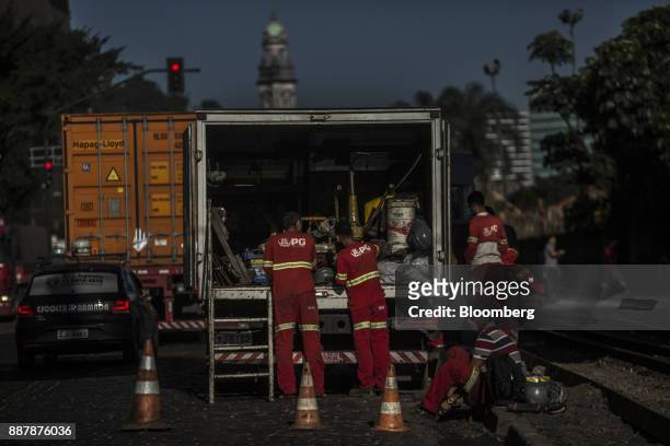 Workers prepare to repair railway tracks at the Port of Santos in Santos, Brazil, on Thursday, Oct. 5, 2017. The port complex is a 3-square-mile...