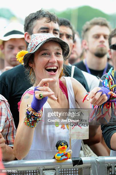 Festival-goer awaits the arrival of Bruce Springsteen during day 3 of the Glastonbury Festival at Worthy Farm in Pilton, Somerset on June 27, 2009...