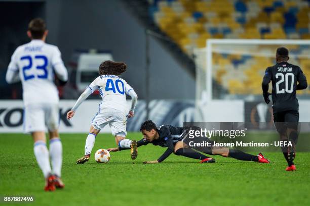 Marko Jevtovic of FK Partizan Belgrade tackles Mykola Shaparenko of FC Dynamo Kyiv during the UEFA Europa League group B match between FC Dynamo Kyiv...