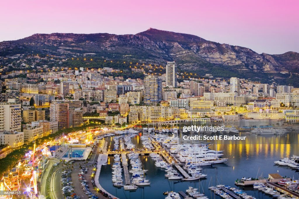 Marina and cityscape of Monaco at dusk