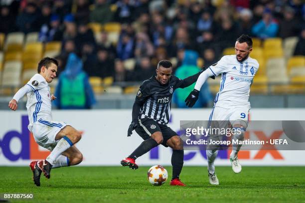 Seydouba Soumah of FK Partizan Belgrade competes with Mykola Morozyuk of FC Dynamo Kyiv during the UEFA Europa League group B match between FC Dynamo...