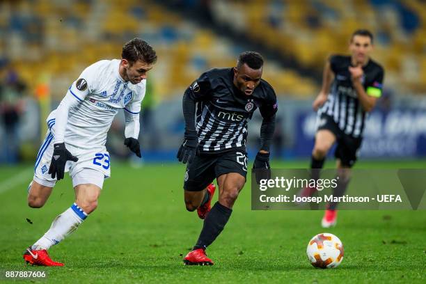 Seydouba Soumah of FK Partizan Belgrade gets away from Josip Pivaric of FC Dynamo Kyiv during the UEFA Europa League group B match between FC Dynamo...