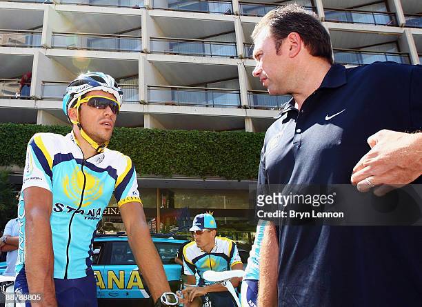 Alberto Contador of Spain and Astana chats to team boss Johan Bruyneel as he prepares to train with his team in preparation for 2009 Tour de France...
