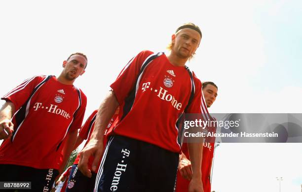Anatoliy Timoshchuk , Franck Ribery and Danijel Pranjic arrive for the FC Bayern Muenchen training session at Bayern's training ground Saebener...