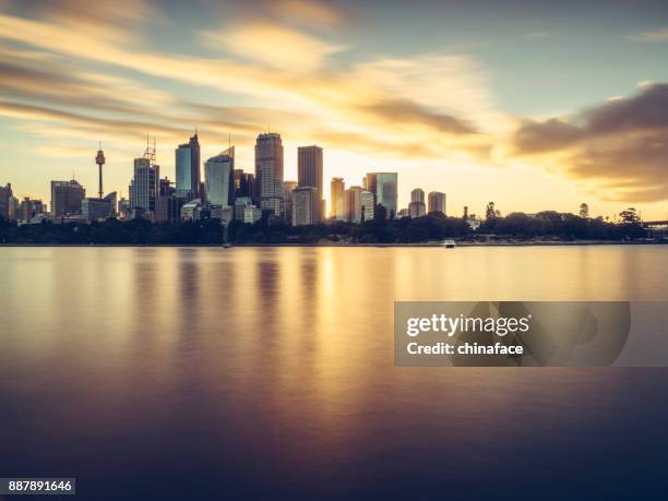 sydney city skyline against sunset sky - dawn skyline stock pictures, royalty-free photos & images