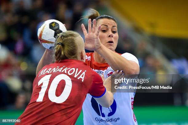 Petra Manakova of Czech Republic and Nora Mork of Norway vie for the ball during IHF Women's Handball World Championship group B match between Czech...