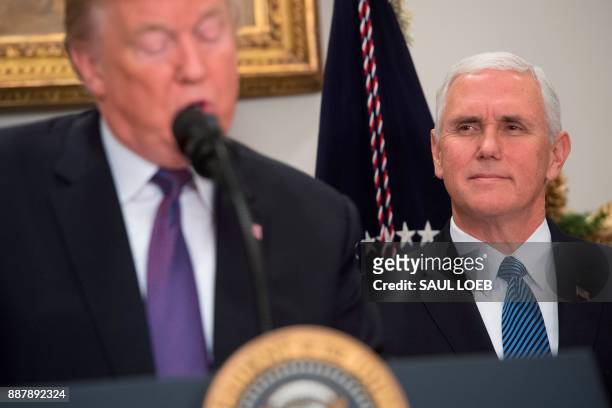 President Donald Trump speaks alongside US Vice President Mike Pence during an event marking National Pearl Harbor Remembrance Day in the Roosevelt...