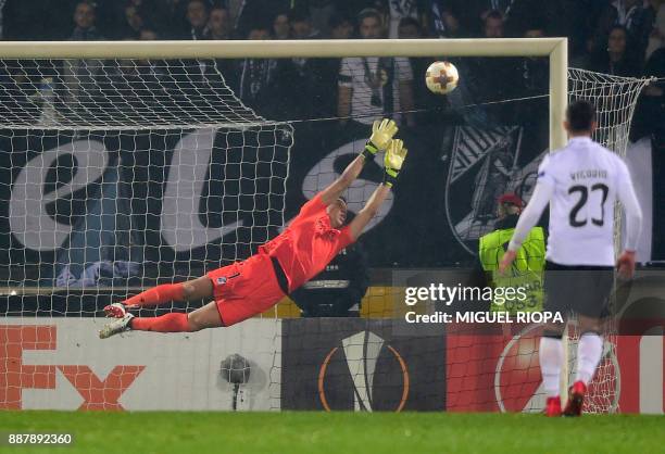 Vitoria Guimaraes' Brazilian goalkeeper Douglas fails to stop a goal during the UEFA Europa League group I football match between Vitoria and...