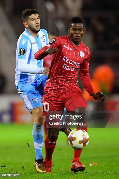 Idrissa Doumbia midfielder of SV Zulte Waregem is challenged by Lucas Crecco midfielder of S.S. Lazio during the UEFA Europa League group K stage...