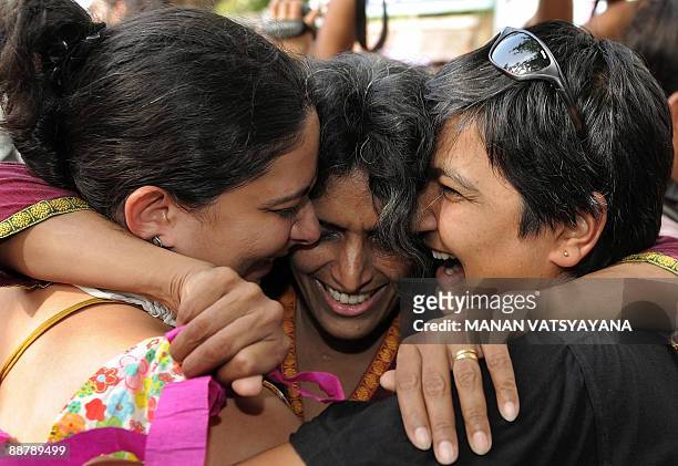 Indian gay activists celebrate the New Delhi High Court ruling decriminalising gay sex, in New Delhi on July 2, 2009. A top Indian court issued a...