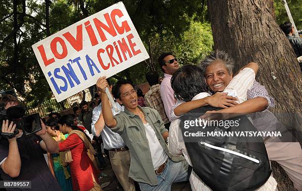 Indian gay activists celebrate the New Delhi High Court ruling decriminalising gay sex, in New Delhi on July 2, 2009. A top Indian court issued a...