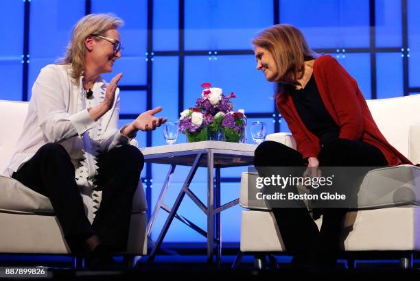 Meryl Streep applauds Gloria Steinem as they speak during the Keynote Luncheon at The Massachusetts Conference For Women at the Boston Convention and...