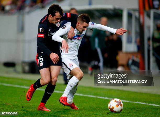 Athletic Bilbao's Yeray Alvarez fights for the ball with Zorya's Artem Sukhotskiy during the UEFA Europa League Group J football match between Zorya...