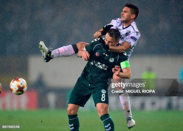 Konyaspor's Turkish midfielder Ali Camdali challenges Vitoria Guimaraes' Colombian midfielder Guillermo Celis during the UEFA Europa League group I...