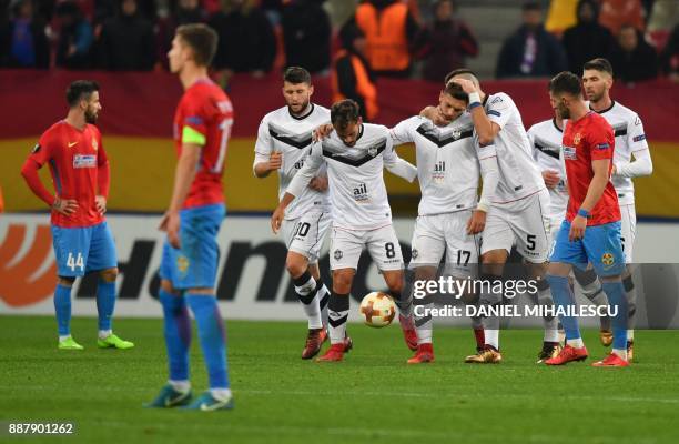 Balint Vecsei of Energy Investment Lugano celebrates with teammates after he scored the 0-2 against Steaua Bucharest during the UEFA Europa League...