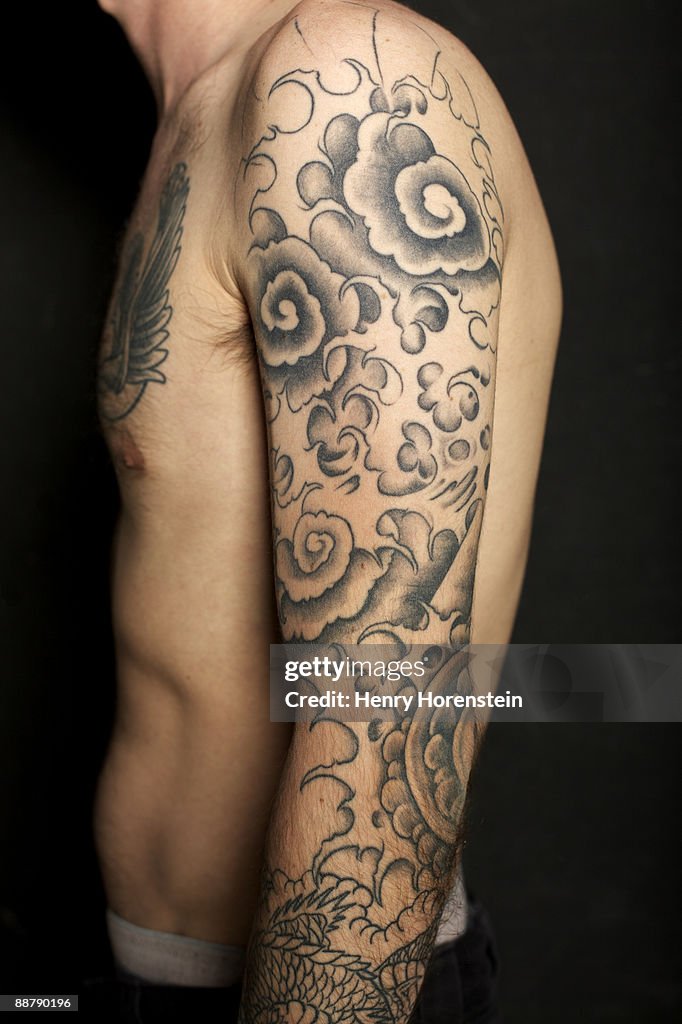 Man With Tattoos On Arms And Chest High-Res Stock Photo - Getty Images