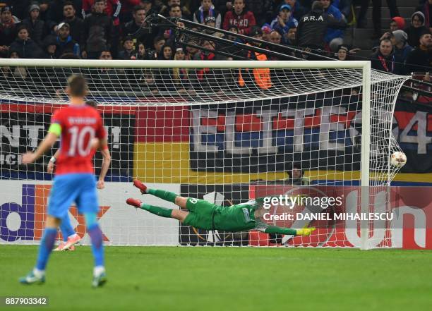 Goalkeeper Daniel Vlad of Steaua Bucharest fails to fend off a goal by Fabio Daprela of Energy Investment Lugano during the UEFA Europa League group...