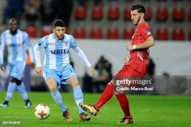 Luca Crecco of SS Lazio compete for the ball with Sandy Walsh of SV Zulte Waregem during the UEFA Europa League group K match between SV Zulte...