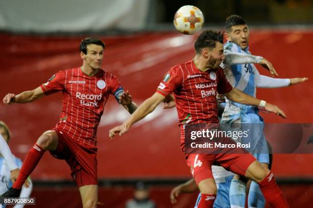 Luca Crecco of SS Lazio compete for the ball with Michael Heylen of SV Zulte Waregem during the UEFA Europa League group K match between SV Zulte...