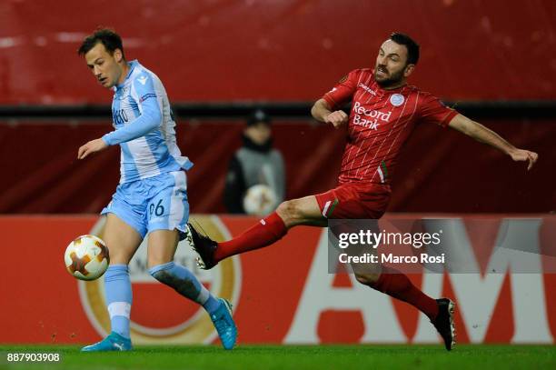 Alessandro Murgua of SS Lazio compete for the ball with Marvin Baudry of SV Zulte Waregem during the UEFA Europa League group K match between SV...