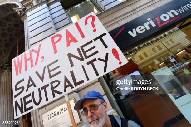 Small group of protestors supporting net neutrality protest against a plan by Federal Communications Commission head Ajit Pai, during a protest...