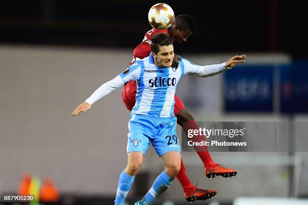 Idrissa Doumbia midfielder of SV Zulte Waregem and Simone Palombi forward of S.S. Lazio jumping towards the ball during the UEFA Europa League group...