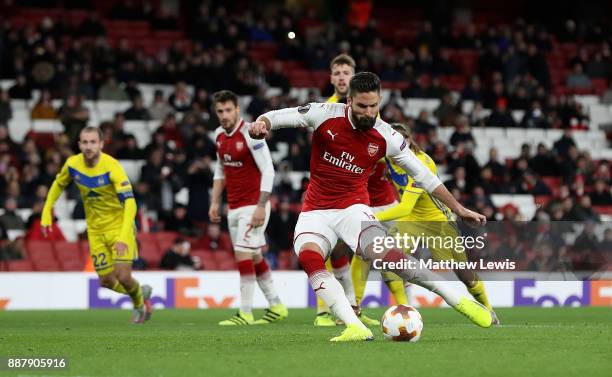 Olivier Giroud of Arsenal scores his teams fifth goal of the game from the penalty spot during the UEFA Europa League group H match between Arsenal...