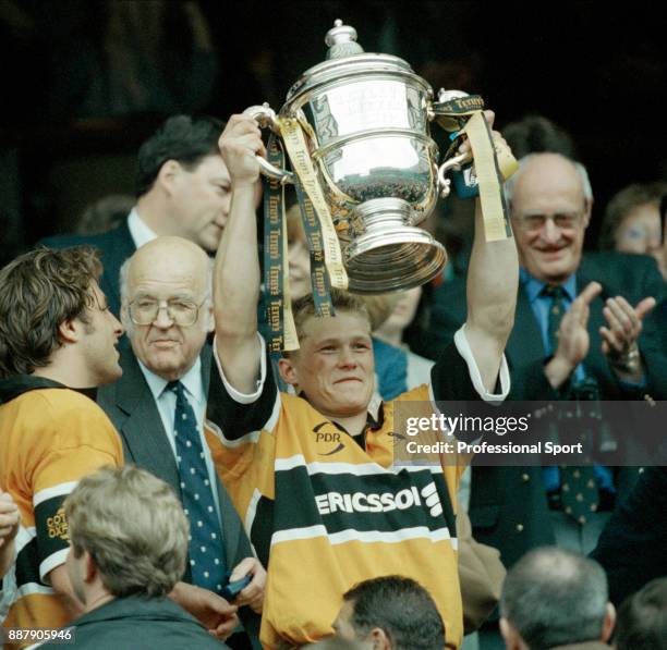Josh Lewsey of Wasps holds aloft the trophy after defeating Newcastle 29-19 in the Tetleys Bitter Rugby Union Cup Final at Twickenham in London on...
