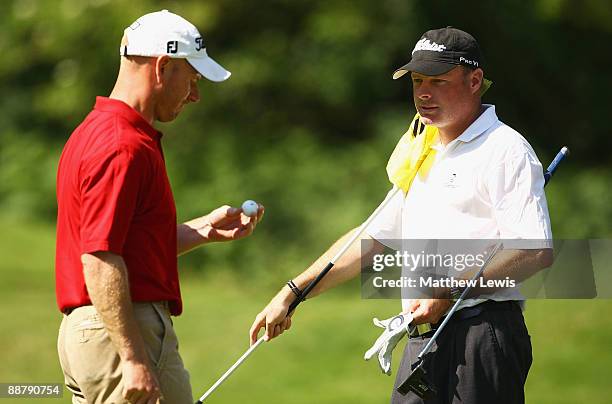 Adrian Ambler of Walton Golf Centre and Aaron Wainwright of Oulton Halldiscuss tactics on the 8th green during the Skycaddie PGA Fourball...