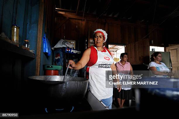Women cook foods to be sold in some outlying areas of the city as part of the project ''Comedores solidarios'' carried out by the government of...