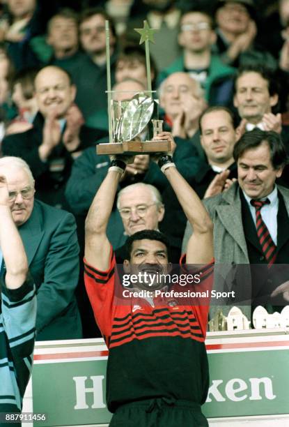 Toulouse captain Emile Ntamack holds aloft the trophy after their 21-18 victory over Cardiff in the Heineken Cup Rugby Union Final at Cardiff Arms...