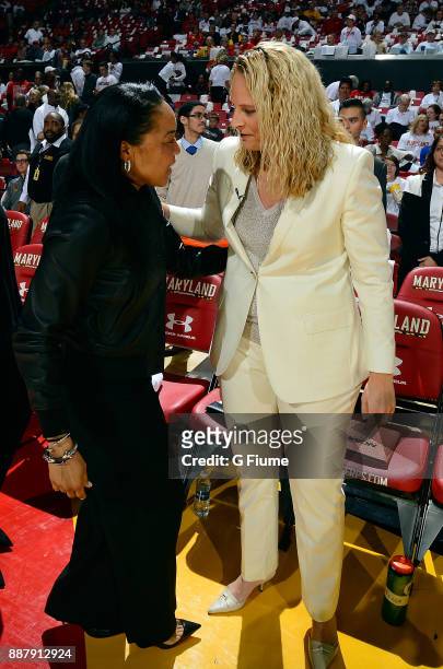 Head Coach Brenda Frese of the Maryland Terrapins talks with Head Coach Dawn Staley of the South Carolina Gamecocks before the game at Xfinity Center...