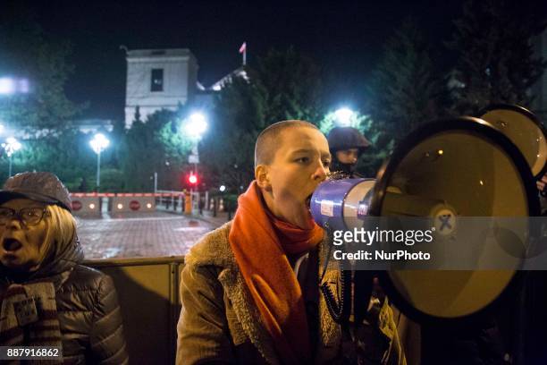 Woman during illegal demonstration near Polish parliament organized by opposition group Obywatele RP in Warsaw on December 7, 2017.