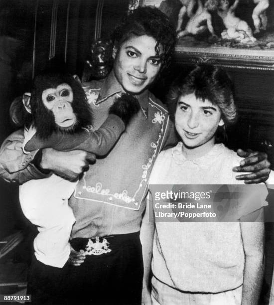 American singer Michael Jackson poses with 14-year-old fan Donna Ashlock and his pet chimpanzee Bubbles at the Neverland Ranch in Santa Barbara...