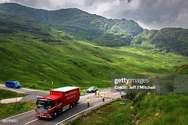 An emergency vehicle goes through a police road block on the A83 in Argyll near to where an RAF Tornado has crashed on July 2, 2009 in Scotland. The...