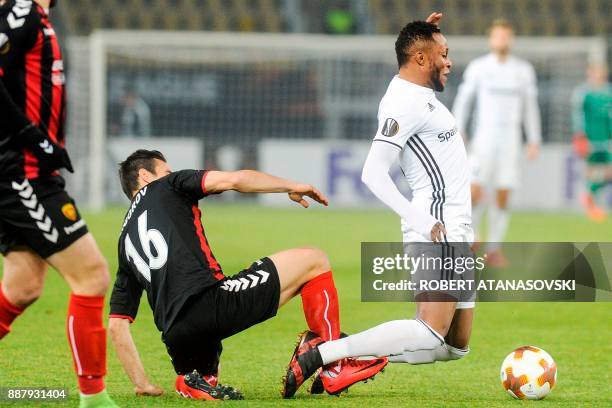 Rosenborg's Samuel Adegbeno is tackled by Vardar's Nikola Gligorov during the UEFA Europa League group L football match between FK Vardar and...