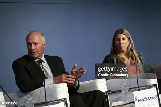 Guillermo Ortiz de Rozas, director of Grupo Arcor SA, left, speaks while Lorena Zicker, general manager of Intel Corp. Argentina, listens during an...