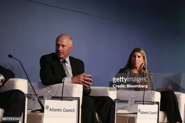 Guillermo Ortiz de Rozas, director of Grupo Arcor SA, left, speaks while Lorena Zicker, general manager of Intel Corp. Argentina, listens during an...