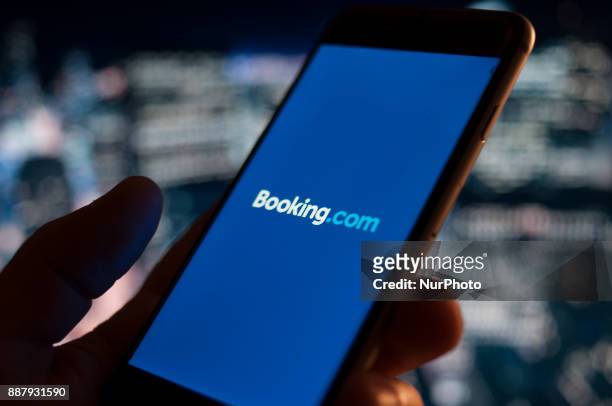 The Booking.com hotel reservations applications is seen on an iPhone on December 7, 2017.