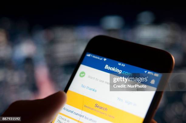 The Booking.com hotel reservations applications is seen on an iPhone on December 7, 2017.