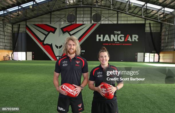 Dyson Heppell and Lauren Morecroft of the Bombers pose at "The Hangar" during an Essendon Bombers Media Announcement & Training Session at Essendon...