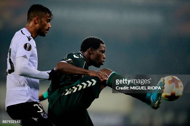 Vitoria Guimaraes' Brazilian defender Jubal challenges Konyaspor's Gabonese forward Malik Evouna during the UEFA Europa League group I football match...