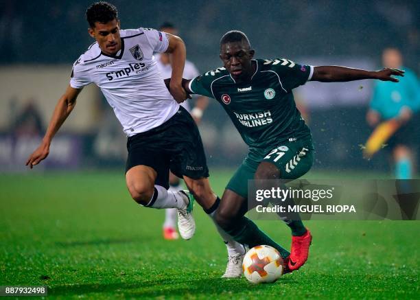 Vitoria Guimaraes' Venezuelan defender Victor Garcia challenges Konyaspor's Ivorian midfielder Moryke Fofana during the UEFA Europa League group I...