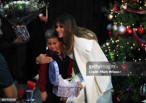 First lady Melania Trump hugs Damian Contreras during a visit to Children's National Medical Center, on December 7, 2017 in Washington, DC. First...